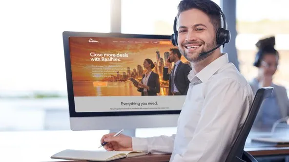 RealNex onboarding specialist with the RealNex platform on screen.