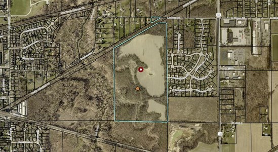 A mix of agricultural ground & wooded sections
