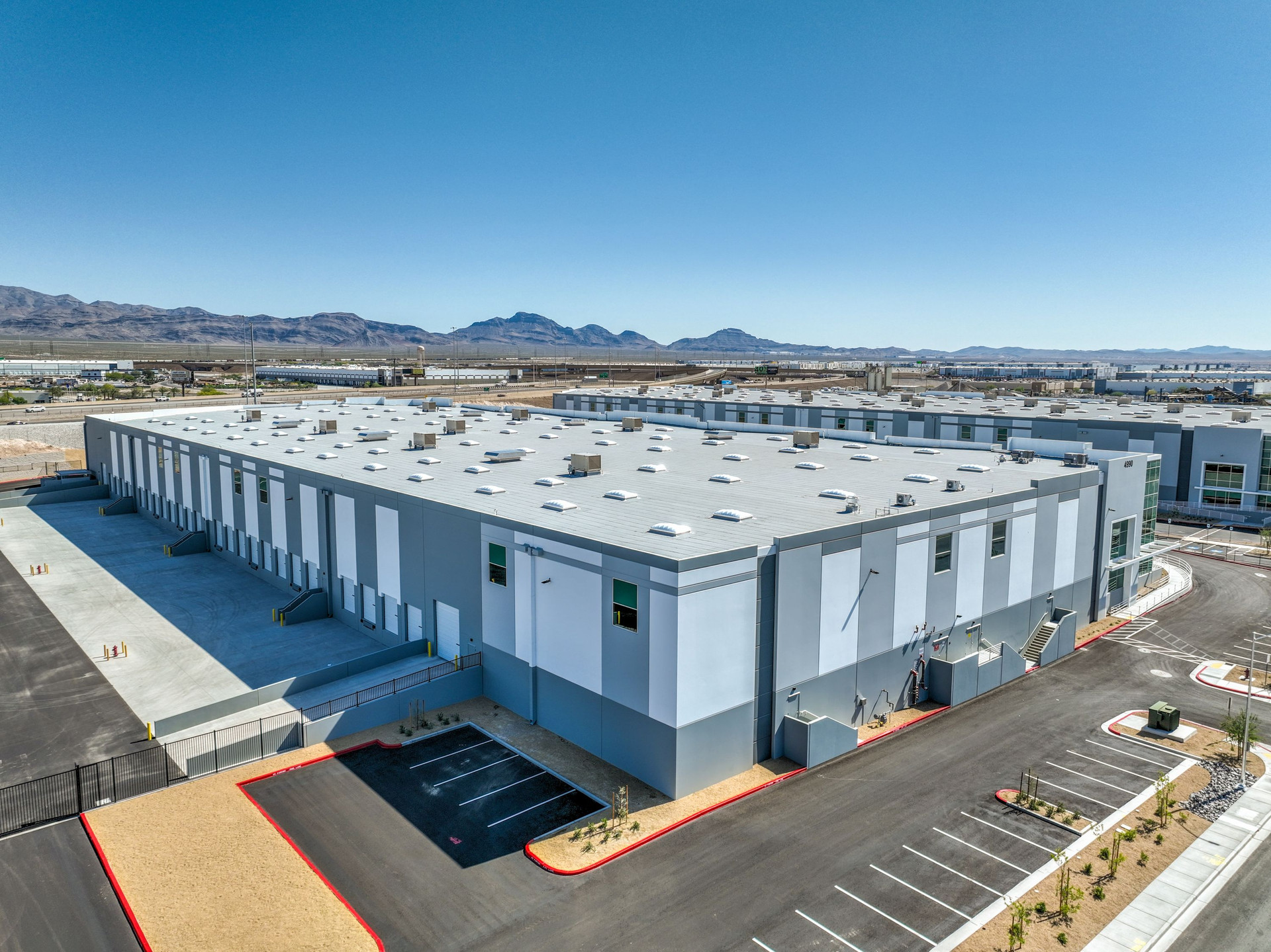  Building 2 ±124,886 SF | Move-In Ready fully fenced truck court yard Last Building Available at OMP I-15 Freeway Center |